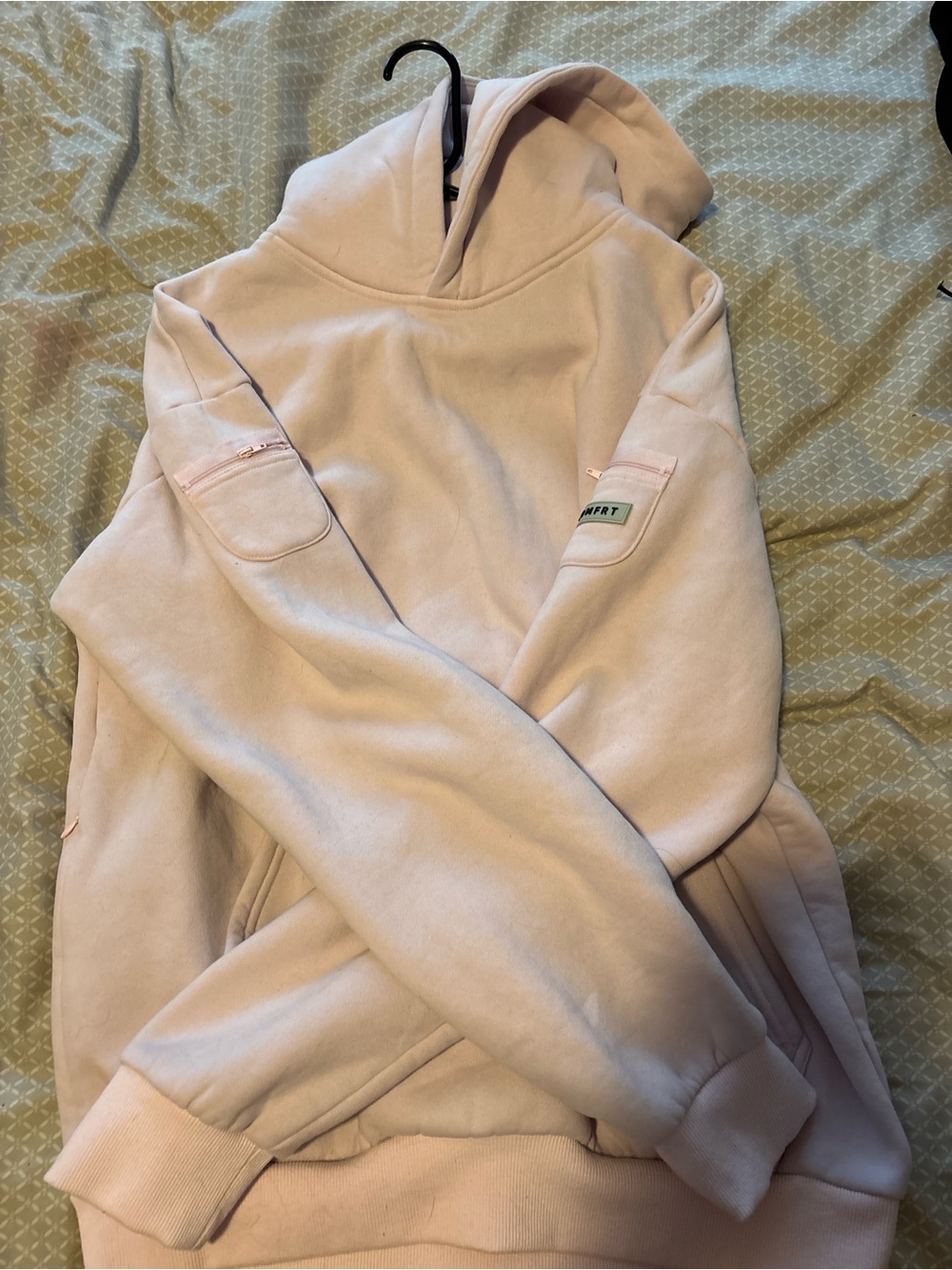 Cozy Pale Pink Hooded Sweatshirt with Sleeve Zip Pocket